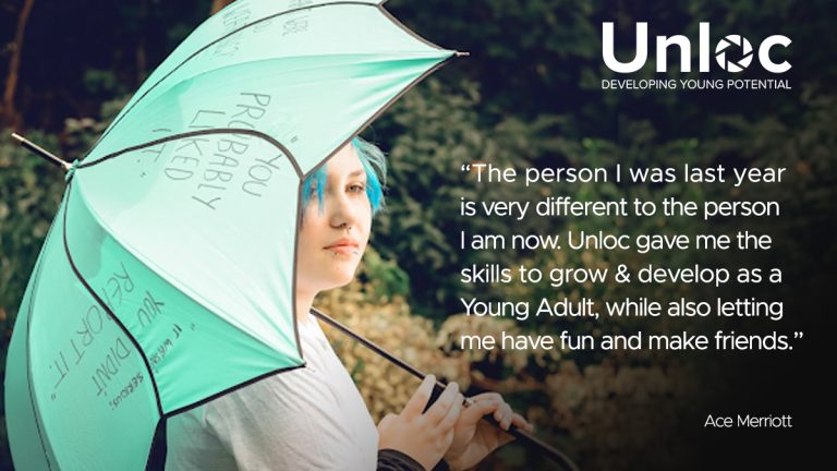 Young person with blue hair holding a mint green umbrella stands outdoors. A quote about personal growth and Unloc is displayed beside them, with the Unloc logo and strapline at the top.