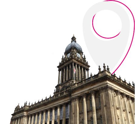 A neoclassical building with a clock tower and columns, partially overlaid by a pink map pin graphic on a white background.