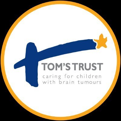 A blue brushstroke with a yellow star forms a T above the text Toms Trust caring for children with brain tumours inside a circular yellow-bordered logo.
