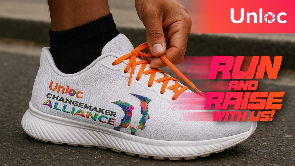 A person ties the orange laces of a white trainer with colourful Unloc Changemaker Alliance branding and the text RUN AND RAISE WITH US! displayed beside it.