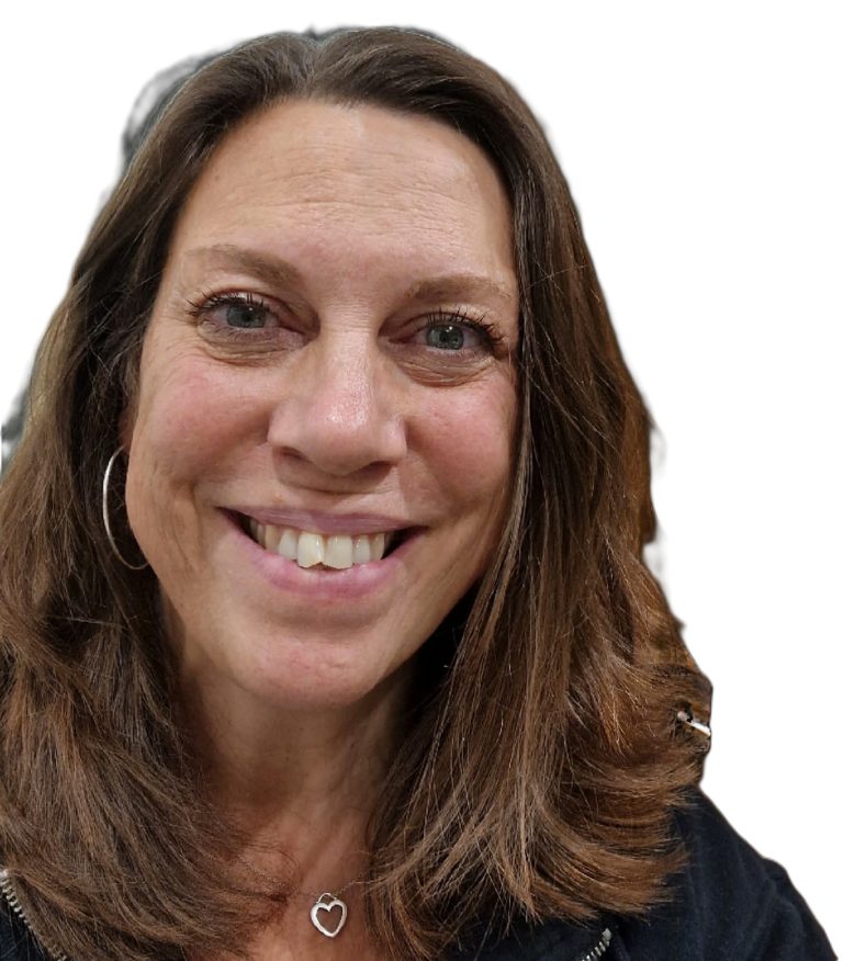 A smiling woman with shoulder-length brown hair and hoop earrings.