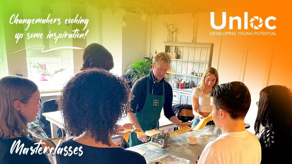 A group of young people watch a man in an apron demonstrating pasta making at a kitchen counter, with Unloc and Masterclasses branding on the image.