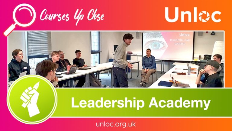 A group of students sit around tables listening to a presenter in a classroom; a screen displays Unloc and Leadership Academy branding.