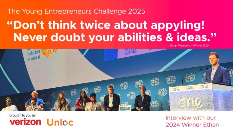 A panel of people sit on stage at an entrepreneurship event, with a large screen displaying a quotation encouraging confidence in applying for the challenge.