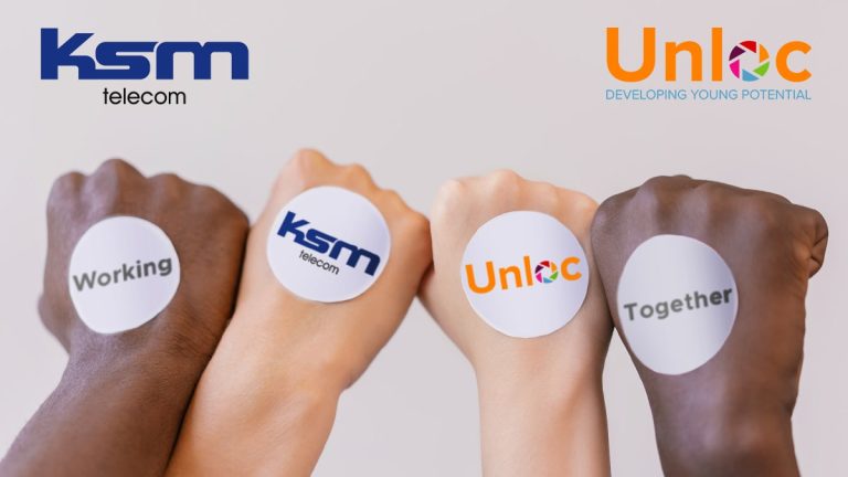 Four hands with different skin tones display circular stickers reading Working, ksm telecom, Unloc, and Together, with the KSM Telecom and Unloc logos in the background.
