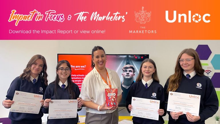 A group of women holding documents.