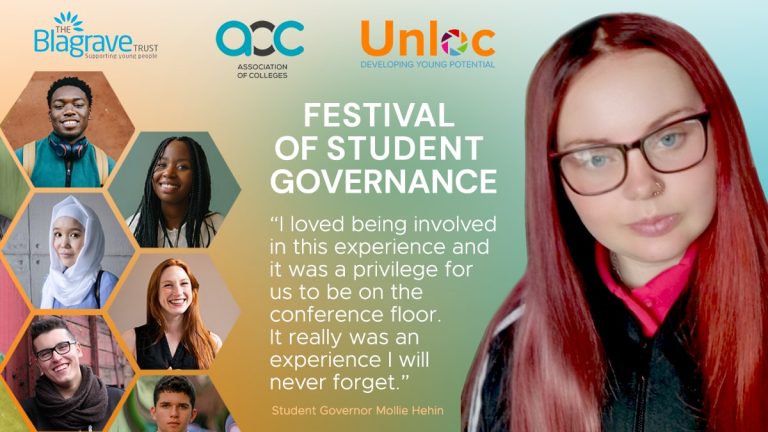 A woman with long red hair and spectacles.